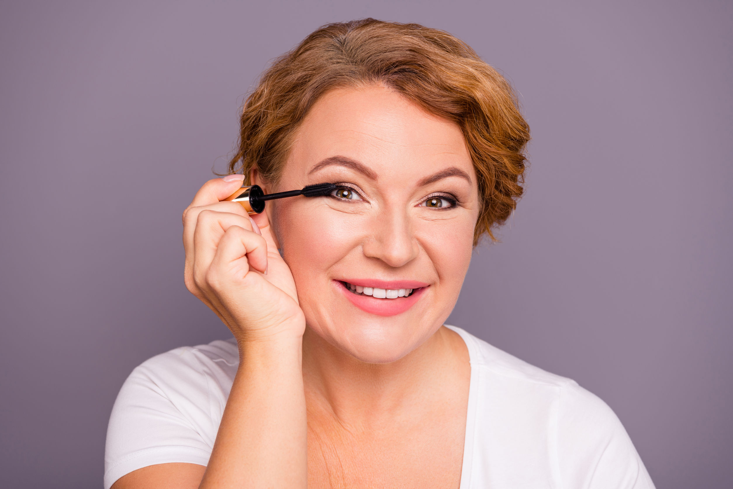 Close up photo beautiful amazing mature she her lady specialist professional hold extra long lashes effect eyelash applying putting cool great result wear white t-shirt isolated grey background.